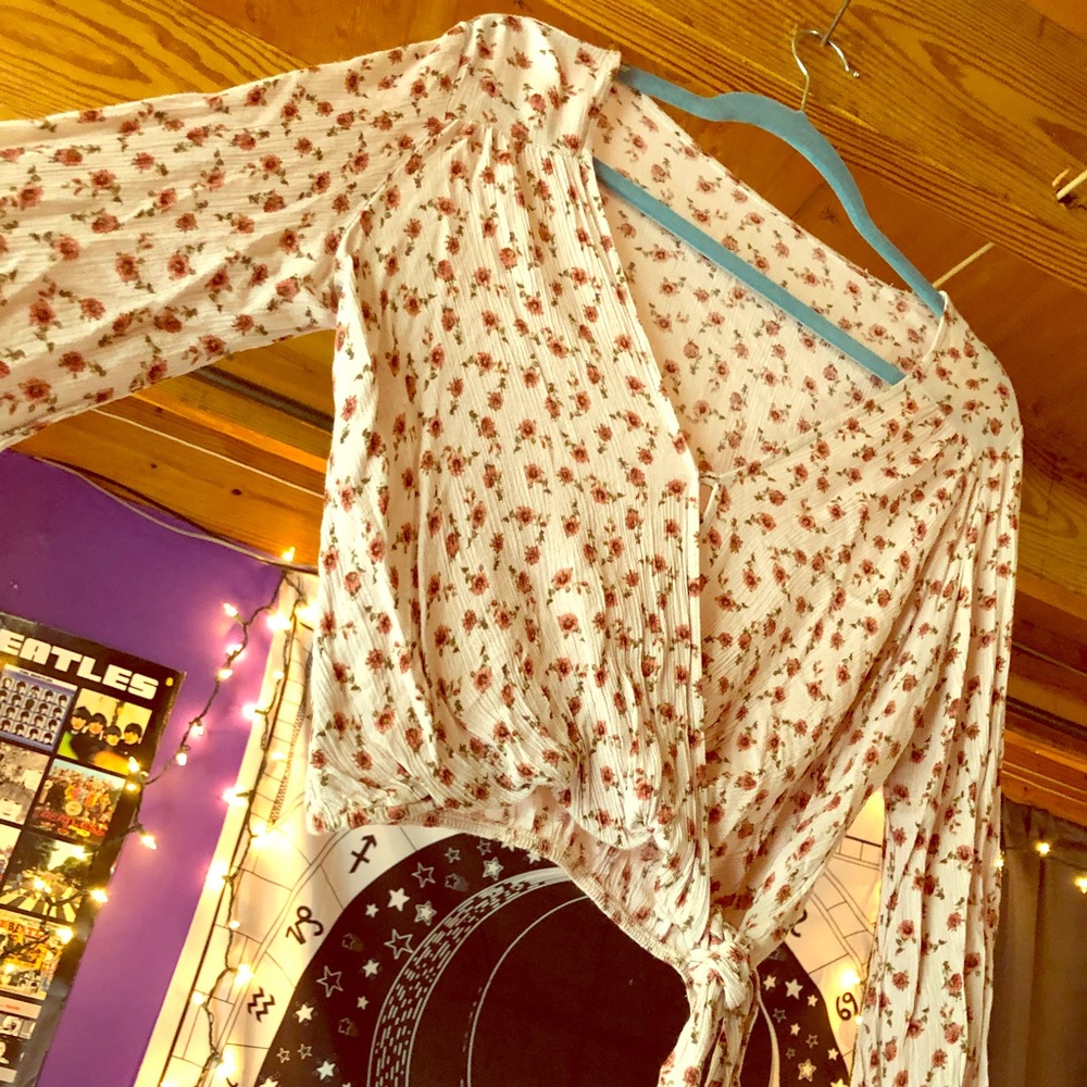 A light pink rose printed blouse with bell sleeves